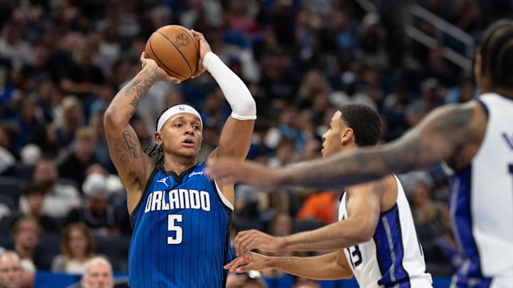Orlando Magic forward Paolo Banchero (5) looks for the pass against Sacramento Kings forward Keegan Murray (13) in the third quarter at Kia Center. 