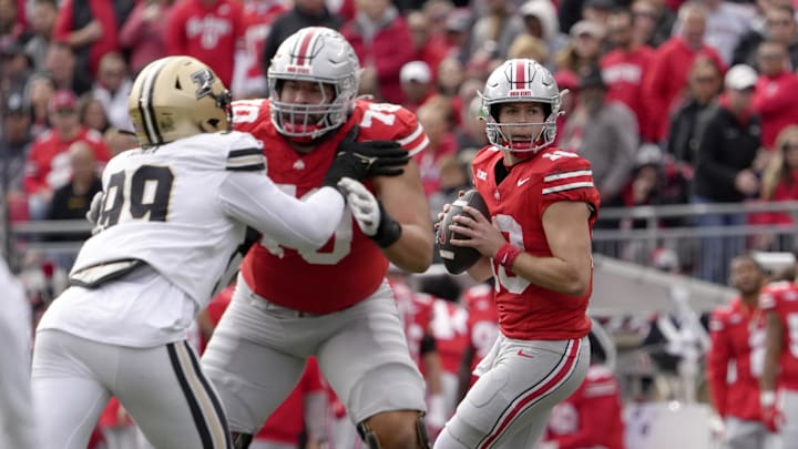 Nov 9, 2024; Columbus, Ohio, USA; Ohio State Buckeyes quarterback Will Howard (18) looks for an open man during the first half  at Ohio Stadium. Mandatory Credit: Barbara Perenic/USA TODAY Network via Imagn Images