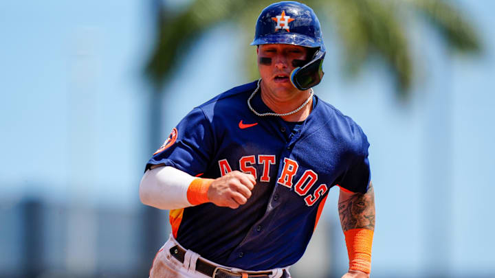 Mar 21, 2023; West Palm Beach, Florida, USA; Houston Astros catcher Korey Lee (11) runs into third base against the Miami Marlins during the third inning at The Ballpark of the Palm Beaches. Mandatory Credit: Rich Storry-Imagn Images