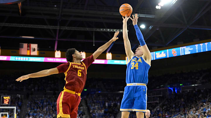 Feb 24, 2026; Los Angeles, California, USA; UCLA Bruins forward Tyler Bilodeau (34) shoots over Southern California Trojans forward Jacob Cofie (6) during the second half at Pauley Pavilion presented by Wescom Financial. Mandatory Credit: Robert Hanashiro-Imagn Images Feb 24, 2026; Los Angeles, California, USA; UCLA Bruins forward Tyler Bilodeau (34) shoots over Southern California Trojans forward Jacob Cofie (6) during the second half at Pauley Pavilion presented by Wescom Financial. Mandatory Credit: Robert Hanashiro-Imagn Images