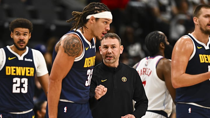 Oct 12, 2025; Inglewood, California, USA; Denver Nuggets Head Coach David Adelman talks with Denver Nuggets forward Aaron Gordon (32) against the Los Angeles Clippers during the second quarter at Intuit Dome. Mandatory Credit: Jonathan Hui-Imagn Images