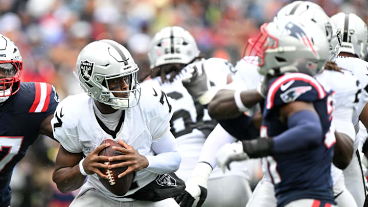 Sep 7, 2025; Foxborough, Massachusetts, USA; Las Vegas Raiders quarterback Geno Smith (7) drops back to pass against the New England Patriots during the first half at Gillette Stadium. Mandatory Credit: Brian Fluharty-Imagn Images