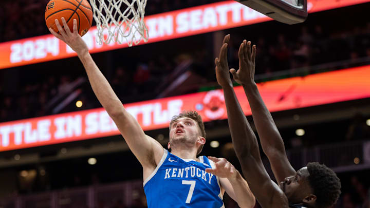 Dec 7, 2024; Seattle, Washington, USA;  Kentucky Wildcats forward Andrew Carr (7) shoots the ball against Gonzaga Bulldogs forward Graham Ike (13) during the second half at Climate Pledge Arena. Mandatory Credit: Stephen Brashear-Imagn Images