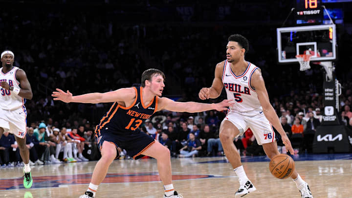 Philadelphia 76ers guard Quentin Grimes dribbles the ball as New York Knicks guard Tyler Kolek defends. Mandatory Credit: John Jones-Imagn Images
