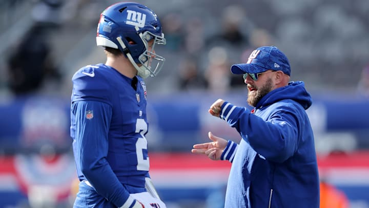 Dec 8, 2024; East Rutherford, New Jersey, USA; New York Giants head coach Brian Daboll talks to quarterback Drew Lock (2) before a game against the New Orleans Saints at MetLife Stadium.  