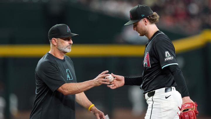Jun 26, 2024; Phoenix, Arizona, USA; Arizona Diamondbacks manager Torey Lovullo (17) removes Arizona Diamondbacks pitcher Ryne Nelson (19) from the game against the Minnesota Twins during the fourth inning at Chase Field. Mandatory Credit: Joe Camporeale-USA TODAY Sports