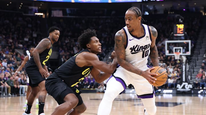 Oct 29, 2024; Salt Lake City, Utah, USA; Sacramento Kings forward DeMar DeRozan (10) moves the ball against Utah Jazz guard Collin Sexton (2) during the second quarter at Delta Center. Mandatory Credit: Rob Gray-Imagn Images