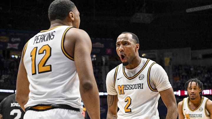 Mar 13, 2025; Nashville, TN, USA;  Missouri Tigers guard Tamar Bates (2) celebrates the foul with guard Tony Perkins (12) against the Mississippi State Bulldogs during the second half at Bridgestone Arena. Mandatory Credit: Steve Roberts-Imagn Images