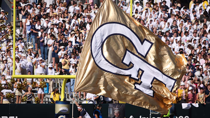 Oct 11, 2025; Atlanta, Georgia, USA; Georgia Tech Yellow Jackets cheerleader runs a flag after a touchdown against the Virginia Tech Hokies in the first quarter at Bobby Dodd Stadium at Hyundai Field. Mandatory Credit: Brett Davis-Imagn Images
 Oct 11, 2025; Atlanta, Georgia, USA; Georgia Tech Yellow Jackets cheerleader runs a flag after a touchdown against the Virginia Tech Hokies in the first quarter at Bobby Dodd Stadium at Hyundai Field. Mandatory Credit: Brett Davis-Imagn Images