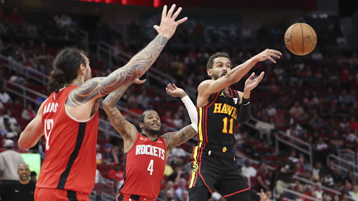 Mar 25, 2025; Houston, Texas, USA; Atlanta Hawks guard Trae Young (11) passes the ball during the fourth quarter against the Houston Rockets at Toyota Center. Mandatory Credit: Troy Taormina-Imagn Images