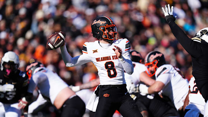 Nov 29, 2024; Boulder, Colorado, USA; Oklahoma State Cowboys quarterback Maealiuaki Smith (8 prepares to pass the ball in the second quarter against the Colorado Buffaloes at Folsom Field. Mandatory Credit: Ron Chenoy-Imagn Images Nov 29, 2024; Boulder, Colorado, USA; Oklahoma State Cowboys quarterback Maealiuaki Smith (8 prepares to pass the ball in the second quarter against the Colorado Buffaloes at Folsom Field. Mandatory Credit: Ron Chenoy-Imagn Images