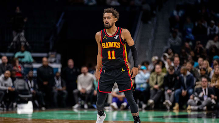 Nov 30, 2024; Charlotte, North Carolina, USA; Atlanta Hawks guard Trae Young (11) reacts during the second quarter against the Charlotte Hornets at Spectrum Center. Mandatory Credit: Scott Kinser-Imagn Images