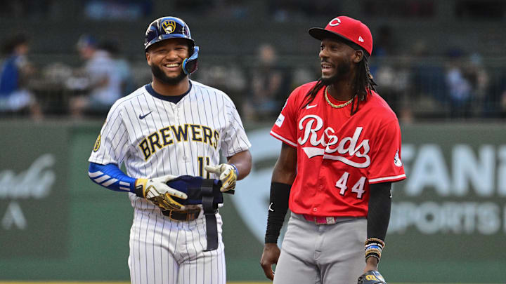 Sep 28, 2025; Milwaukee, Wisconsin, USA; Milwaukee Brewers center fielder Jackson Chourio (11) talks to Cincinnati Reds shortstop Elly De La Cruz (44) after hitting a double in the third inning at American Family Field. Mandatory Credit: Benny Sieu-Imagn Images Sep 28, 2025; Milwaukee, Wisconsin, USA; Milwaukee Brewers center fielder Jackson Chourio (11) talks to Cincinnati Reds shortstop Elly De La Cruz (44) after hitting a double in the third inning at American Family Field. Mandatory Credit: Benny Sieu-Imagn Images