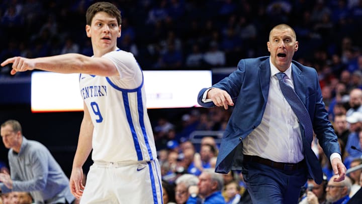 Nov 21, 2025; Lexington, Kentucky, USA; Kentucky Wildcats head coach Mark Pope calls out to his players while forward Trent Noah (9) directs his teammates during the second half against the Loyola (MD) Greyhounds at Rupp Arena at Central Bank Center. Mandatory Credit: Jordan Prather-Imagn Images Nov 21, 2025; Lexington, Kentucky, USA; Kentucky Wildcats head coach Mark Pope calls out to his players while forward Trent Noah (9) directs his teammates during the second half against the Loyola (MD) Greyhounds at Rupp Arena at Central Bank Center. Mandatory Credit: Jordan Prather-Imagn Images
