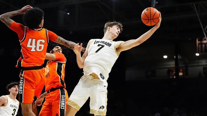Feb 21, 2026; Boulder, Colorado, USA; Colorado Buffaloes forward Sebastian Rancik (7) pulls in a rebound in the second half against the Oklahoma State Cowboys at the CU Events Center. Mandatory Credit: Ron Chenoy-Imagn Images