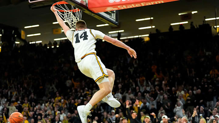 Iowa guard Bennett Stirtz (14) dunks to give the Iowa Hawkeyes their first lead against the USC Trojans Jan. 28, 2026 at Carver-Hawkeye Arena in Iowa City, Iowa. Iowa guard Bennett Stirtz (14) dunks to give the Iowa Hawkeyes their first lead against the USC Trojans Jan. 28, 2026 at Carver-Hawkeye Arena in Iowa City, Iowa.