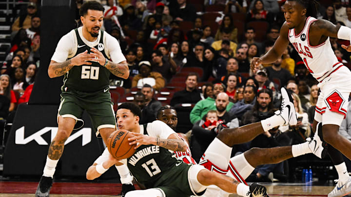 Milwaukee Bucks guard Ryan Rollins grabs a ball away from Chicago Bulls forward Patrick Williams during the second half at the United Center on October 12.