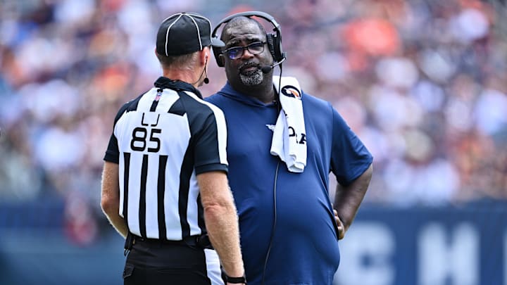 Aug 12, 2023; Chicago, Illinois, USA;  Tennessee Titans Assistant Head Coach Terrell Williams talks with Line Judge Daniel Gallagher (85) in the second half against the Chicago Bears at Soldier Field. Mandatory Credit: Jamie Sabau-Imagn Images