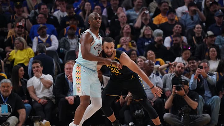 Apr 9, 2025; San Francisco, California, USA;  San Antonio Spurs guard Chris Paul (3) is guarded by Golden State Warriors guard Stephen Curry (30) in the second period at Chase Center. Mandatory Credit: David Gonzales-Imagn Images