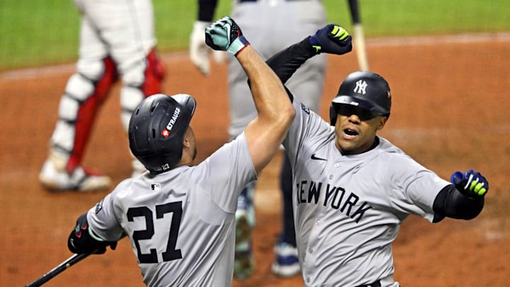 Giancarlo Stanton (left) and Juan Soto high-five during Game 5 of the ALCS.