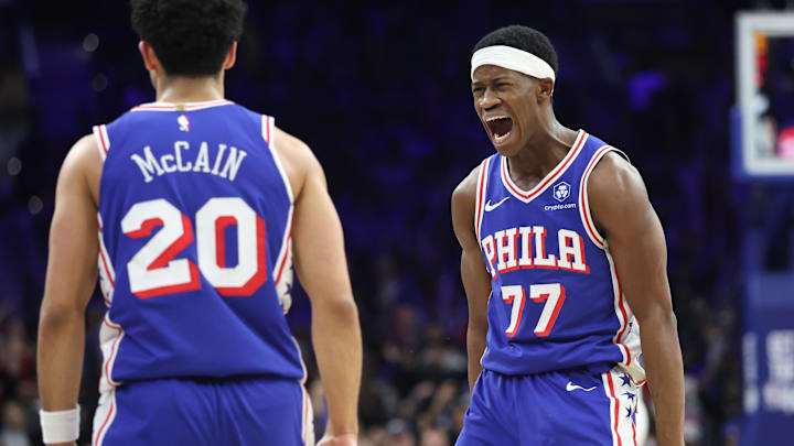 Jan 27, 2026; Philadelphia, Pennsylvania, USA; Philadelphia 76ers guard Vj Edgecombe (77) reacts to guard Jared McCain (20) three pointer against the Milwaukee Bucks during the fourth quarter at Xfinity Mobile Arena. Mandatory Credit: Bill Streicher-Imagn Images