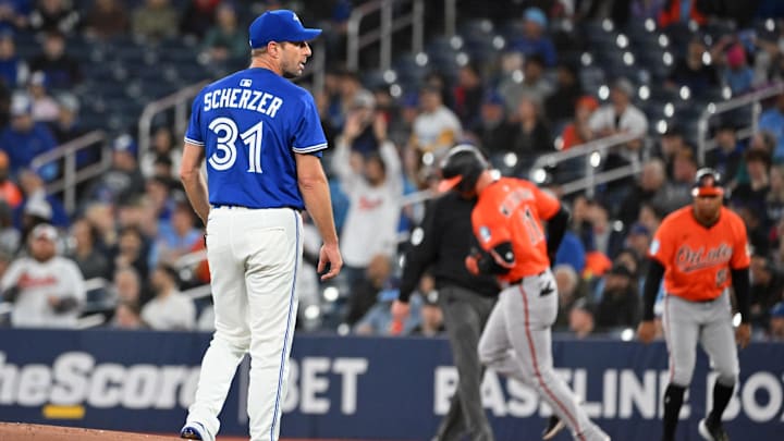 Blue Jays pitcher Max Scherzer (31) waits for a new ball as Baltimore Orioles second baseman Jordan Westburg (11) rounds the bases after hitting a solo home run in the first inning at Rogers Centre on March 29.