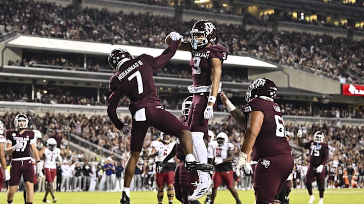 Nov 16, 2024; College Station, Texas, USA; Texas A&M Aggies wide receiver Moose Muhammad III (7) celebrates after scoring a touchdown during the second quarter with wide receiver Noah Thomas (3) against the New Mexico State Aggies at Kyle Field. Mandatory Credit: Maria Lysaker-Imagn Images 