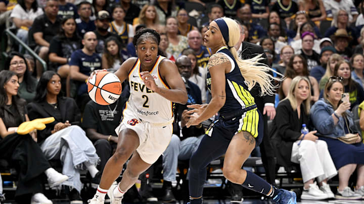 Aug 1, 2025; Dallas, Texas, USA; Indiana Fever guard Aari McDonald (2) drives to the basket past Dallas Wings guard DiJonai Carrington (21) during the second half at the American Airlines Center. Mandatory Credit: Jerome Miron-Imagn Images Aug 1, 2025; Dallas, Texas, USA; Indiana Fever guard Aari McDonald (2) drives to the basket past Dallas Wings guard DiJonai Carrington (21) during the second half at the American Airlines Center. Mandatory Credit: Jerome Miron-Imagn Images