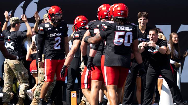 Cincinnati Bearcats quarterback Brendan Sorsby (2) celebrates with teammates in the second quarter of the NCAA football game between the Cincinnati Bearcats and Iowa State Cyclones at Nippert Stadium in Cincinnati on Oct. 4, 2025. Cincinnati Bearcats quarterback Brendan Sorsby (2) celebrates with teammates in the second quarter of the NCAA football game between the Cincinnati Bearcats and Iowa State Cyclones at Nippert Stadium in Cincinnati on Oct. 4, 2025.