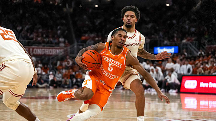Tennessee guard Zakai Zeigler (5) pushes past Texas Longhorns guard Jordan Pope (0) during the game at the Moody Center on Saturday, Jan. 11, 2025.