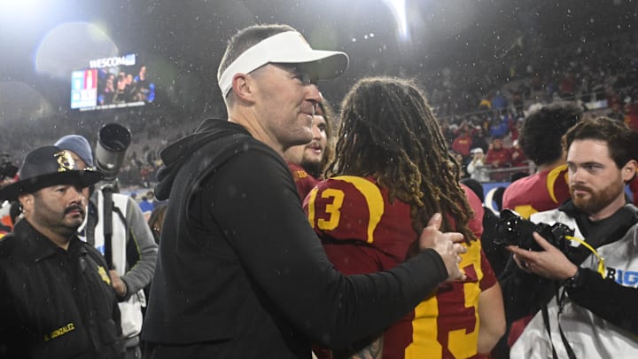 Nov 23, 2024; Pasadena, California, USA; USC Trojans head coach Lincoln Riley smiles after Trojans defeat the UCLA Bruins at Rose Bowl. Mandatory Credit: Robert Hanashiro-Imagn Images Nov 23, 2024; Pasadena, California, USA; USC Trojans head coach Lincoln Riley smiles after Trojans defeat the UCLA Bruins at Rose Bowl. Mandatory Credit: Robert Hanashiro-Imagn Images
