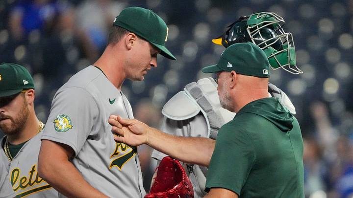 Aug 19, 2026; Kansas City, Missouri, USA; Athletics manager Mark Kotsay (7) greets pitcher Scott Blewett (49) as he comes to the mound against the Kansas City Royals during the sixth inning at Kauffman Stadium. Mandatory Credit: Denny Medley-Imagn Images Aug 19, 2026; Kansas City, Missouri, USA; Athletics manager Mark Kotsay (7) greets pitcher Scott Blewett (49) as he comes to the mound against the Kansas City Royals during the sixth inning at Kauffman Stadium. Mandatory Credit: Denny Medley-Imagn Images