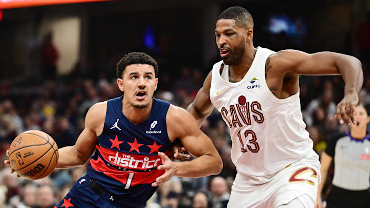 Dec 13, 2024; Cleveland, Ohio, USA; Washington Wizards guard Johnny Davis (1) drives to the basket against Cleveland Cavaliers center Tristan Thompson (13) during the first half at Rocket Mortgage FieldHouse. Mandatory Credit: Ken Blaze-Imagn Images