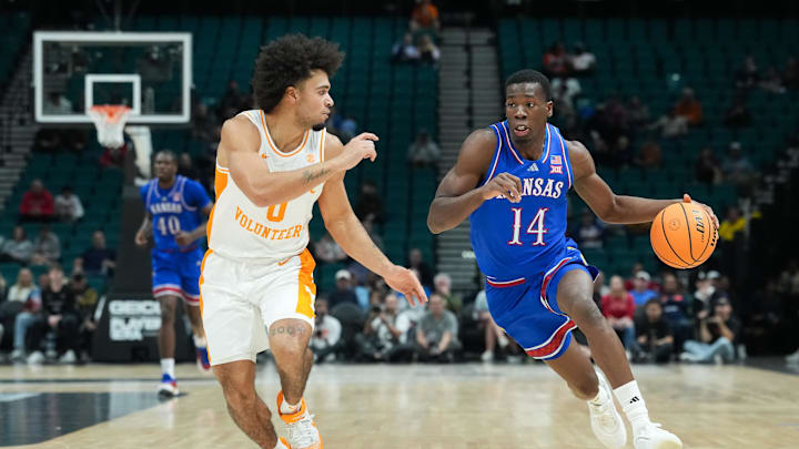 Nov 26, 2025; Las Vegas, NV, USA; Kansas Jayhawks guard Melvin Council Jr. (14) controls the ball while defended by Tennessee Volunteers guard Ja’Kobi Gillespie (0) in the second half in the 2025 Players Era Festival third place game at MGM Grand Garden Arena. Mandatory Credit: Kirby Lee-Imagn Images Nov 26, 2025; Las Vegas, NV, USA; Kansas Jayhawks guard Melvin Council Jr. (14) controls the ball while defended by Tennessee Volunteers guard Ja’Kobi Gillespie (0) in the second half in the 2025 Players Era Festival third place game at MGM Grand Garden Arena. Mandatory Credit: Kirby Lee-Imagn Images