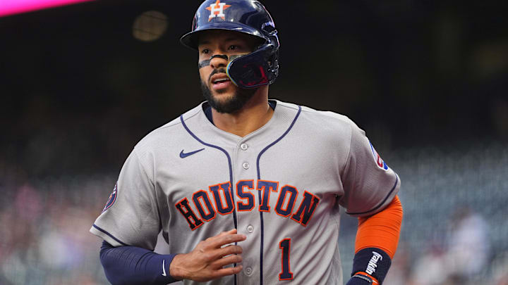 Houston Astros third baseman Carlos Correa scores a run.