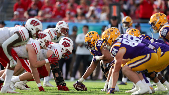 Jan 1, 2024; Tampa, FL, USA;  the Wisconsin Badgers and LSU Tigers line up in the fourth quarter