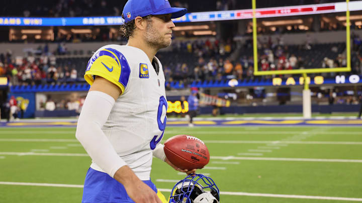Nov 23, 2025; Inglewood, California, USA; Los Angeles Rams quarterback Matthew Stafford (9) walks off the field with a game ball after the game against the Tampa Bay Buccaneers at SoFi Stadium. Mandatory Credit: Kiyoshi Mio-Imagn Images