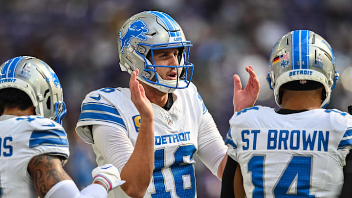 Detroit Lions quarterback Jared Goff (16) warms up with wide receiver Amon-Ra St. Brown (14) 