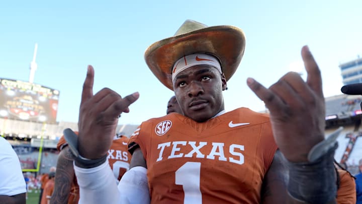 Texas Longhorns defensive end Colin Simmons celebrates with the golden hat following the Red River Rivalry college football game between the University of Oklahoma Sooners and the Texas Longhorn at the Cotton Bowl Stadium. Texas Longhorns defensive end Colin Simmons celebrates with the golden hat following the Red River Rivalry college football game between the University of Oklahoma Sooners and the Texas Longhorn at the Cotton Bowl Stadium.