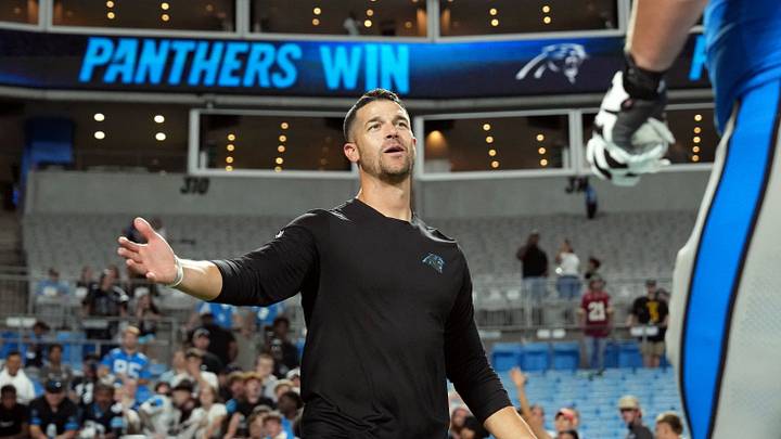Carolina Panthers head coach Dave Canale greets offensive lineman Brady Christensen Carolina Panthers head coach Dave Canale greets offensive lineman Brady Christensen