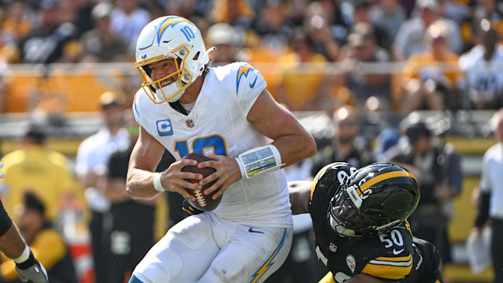 Sep 22, 2024; Pittsburgh, Pennsylvania, USA; Pittsburgh Steelers linebacker Elandon Roberts (50) sacks Los Angeles Chargers quarterback Justin Herbert (10) during the third quarter at Acrisure Stadium. Mandatory Credit: Barry Reeger-Imagn Images