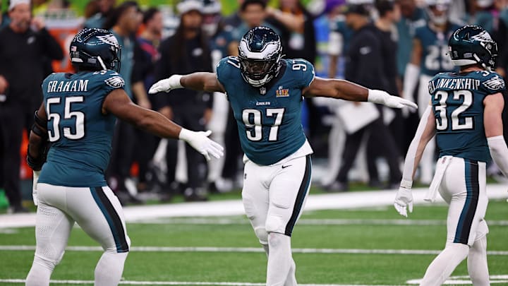 Feb 9, 2025; New Orleans, LA, USA; Philadelphia Eagles defensive tackle Moro Ojomo (97) celebrates with defensive end Brandon Graham (55) after a play against the Kansas City Chiefs during the first half of Super Bowl LIX at Caesars Superdome. Mandatory Credit: Bill Streicher-Imagn Images