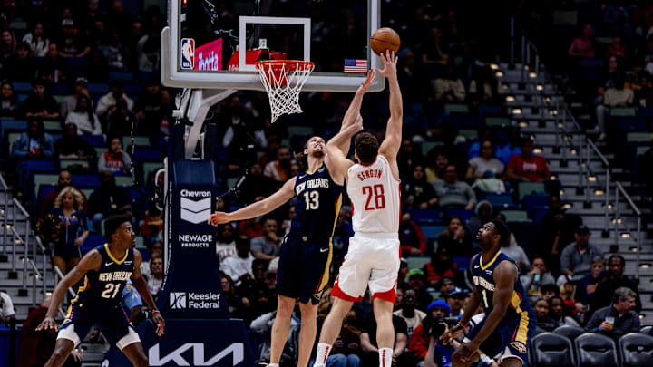 Mar 6, 2025; New Orleans, Louisiana, USA;  Houston Rockets center Alperen Sengun (28) shoots over New Orleans Pelicans forward Kelly Olynyk (13) during the first half at Smoothie King Center. Mandatory Credit: Stephen Lew-Imagn Images