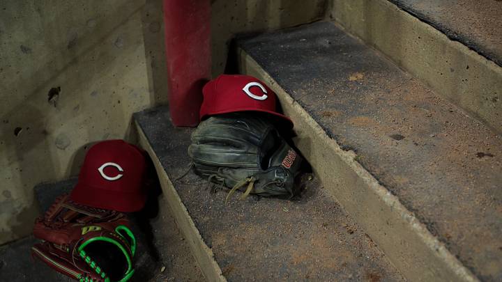 Aug 31, 2026; Cincinnati, Ohio, USA; On field hats of the Cincinnati Reds are seen on the dugout steps during the game against the San Diego Padres at Great American Ball Park. Mandatory Credit: Aaron Doster-Imagn Images Aug 31, 2026; Cincinnati, Ohio, USA; On field hats of the Cincinnati Reds are seen on the dugout steps during the game against the San Diego Padres at Great American Ball Park. Mandatory Credit: Aaron Doster-Imagn Images