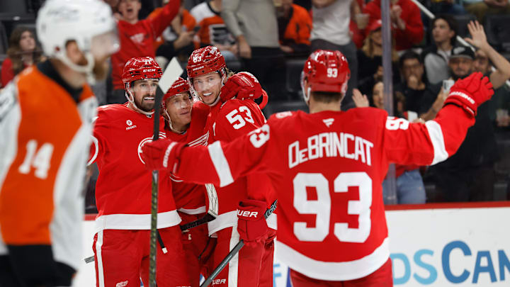 Mar 28, 2026; Detroit, Michigan, USA;  Detroit Red Wings defenseman Moritz Seider (53) receives congratulations from teammates after scoring in the second period against the Philadelphia Flyers at Little Caesars Arena. Mandatory Credit: Rick Osentoski-Imagn Images