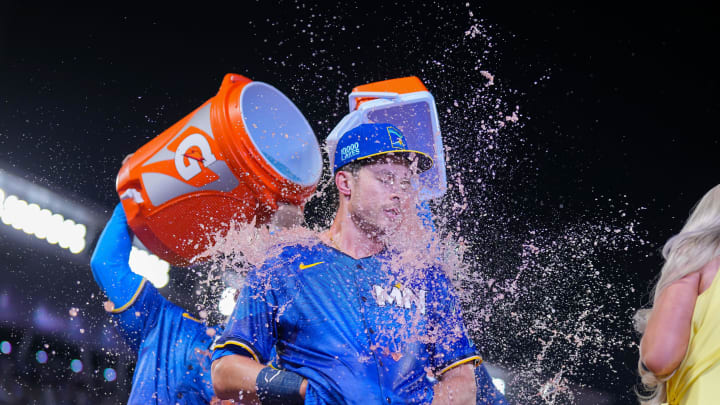 Jun 14, 2024; Minneapolis, Minnesota, USA; Minnesota Twins outfielder Max Kepler (26) gets a Gatorade bath after his game winning base hit against the Oakland Athletics in the tenth inning at Target Field. Mandatory Credit: Brad Rempel-USA TODAY Sports