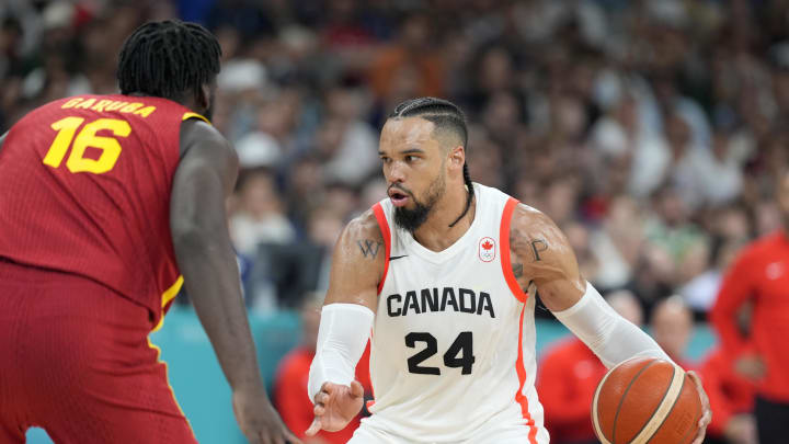 Aug 2, 2024; Villeneuve-d'Ascq, France; Canada small forward Dillon Brooks (24) controls the ball against Spain forward Usman Garuba (16) in the second half in a men’s group A basketball game during the Paris 2024 Olympic Summer Games at Stade Pierre-Mauroy. Mandatory Credit: John David Mercer-USA TODAY Sports