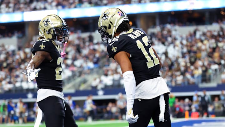 Sep 15, 2024; Arlington, Texas, USA; New Orleans Saints wide receiver Chris Olave (12) celebrates with New Orleans Saints wide receiver Rashid Shaheed (22) during the first quarter against the Dallas Cowboys at AT&T Stadium. Mandatory Credit: Kevin Jairaj-Imagn Images Sep 15, 2024; Arlington, Texas, USA; New Orleans Saints wide receiver Chris Olave (12) celebrates with New Orleans Saints wide receiver Rashid Shaheed (22) during the first quarter against the Dallas Cowboys at AT&T Stadium. Mandatory Credit: Kevin Jairaj-Imagn Images