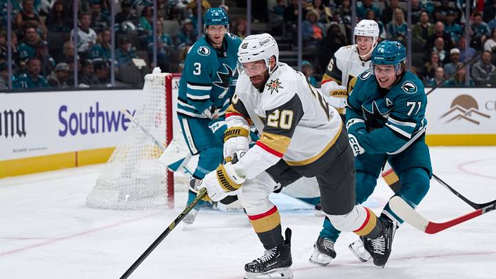 Oct 9, 2025; San Jose, California, USA; Vegas Golden Knights left wing Brandon Saad (20) plays the puck and right wing Pavel Dorofeyev (16) looks on against San Jose Sharks center Macklin Celebrini (71) and defenseman John Klingberg (3) during the first period at SAP Center at San Jose. Mandatory Credit: Robert Edwards-Imagn Images