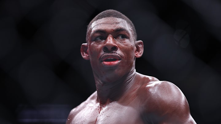 Dec 14, 2024; Tampa, Florida, UNITED STATES; Joaquin Buckley (blue gloves) reacts after the fight against Colby Covington (red gloves) at Amalie Arena. Mandatory Credit: Nathan Ray Seebeck-Imagn Images